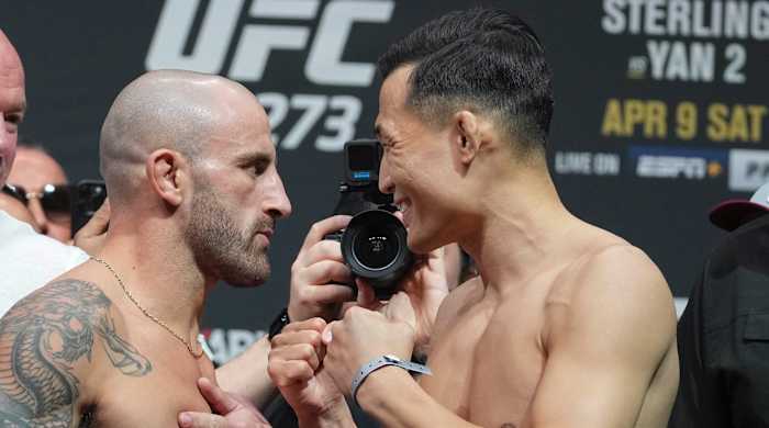 Alexander Volkanovski faces off with the Korean Zombie during weigh ins for UFC 273 at VyStar Veterans Memorial Stadium.